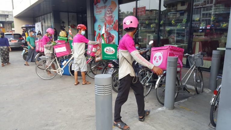A delivery service, extending image in metropolis Yangon | Myanmar ...